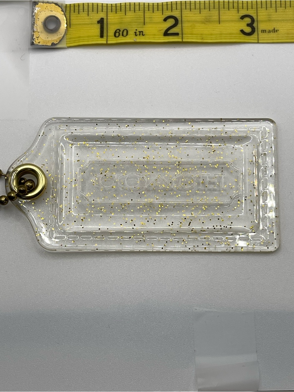 Coach Poppy Clear Acrylic Hang Tag with Gold Flecks